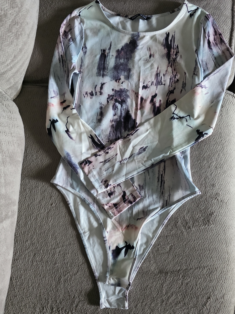 Fashion Nova Long-Sleeve Marble Print Bodysuit in Light Blue and Pink